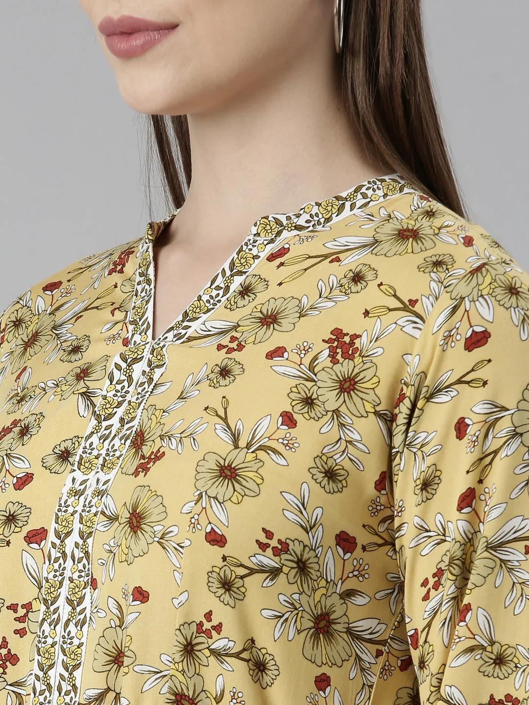 Neeru's Yellow Straight Casual Floral Dresses